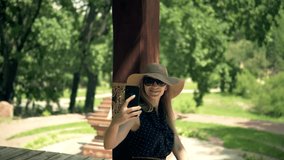 Woman Using Mobile Phone For Selfie Photo. Selfie On Smartphone In Beautiful Place. Attractive Tourist Girl Using Mobile App Selfie Photo Video. Woman Taking Picture Vacation Holiday. Asia Park Relax