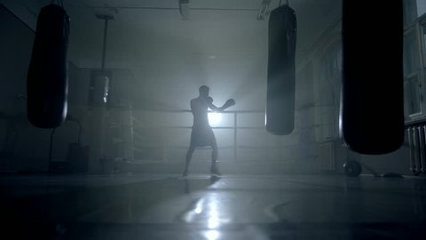 Man boxer training for a hard fight