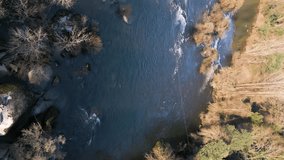 Aerial Over Tâmega River’s Rocky Banks at Sunset