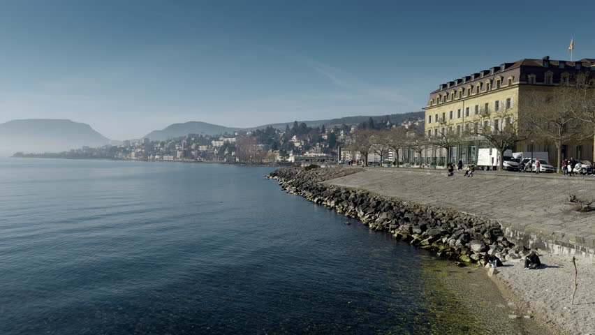 View of the city of Neuchatel in Switzerland with lake and buildings.