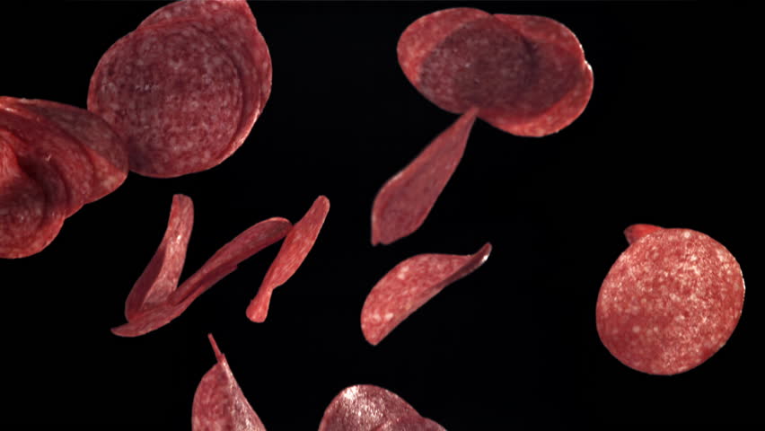 Sliced salami flies up and falls down. Filmed on a high-speed camera at 1000 fps. High quality FullHD footage
