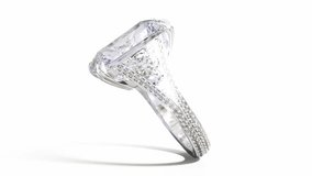 Rotating big emerald cut diamond white gold ring. 3d animation on white background. During rotation, the diamond ring mockup becomes a finished product. 3d animation - Powered by Shutterstock - Get 15% off with code: PIKWIZARD15