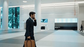 Professional leader walking to escalator while calling his business team about startup project. Smart business man talking about marketing plan to colleague by using phone. Business team. Exultant. - Powered by Shutterstock - Get 15% off with code: PIKWIZARD15