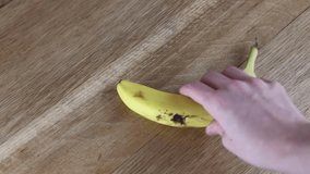 Grabbing banana, placing banana, whole, cutting board, wood table, food and fruit - Powered by Shutterstock - Get 15% off with code: PIKWIZARD15