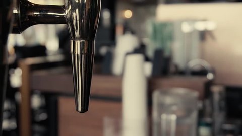 Close up of Sparkling Cold Brew Coffee pouring to glass and ready to drink in slow motion