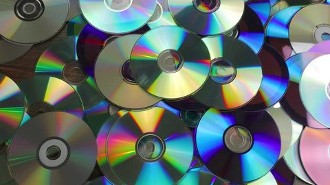 Throwing old CDs in a pile carelessly