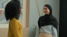 Business partners handshaking diverse multiracial women happy cheerful businesswomen shaking hands African American girl handshake Arabian muslim islamic woman in hijab partnership agreement in office - Powered by Shutterstock - Get 15% off with code: PIKWIZARD15