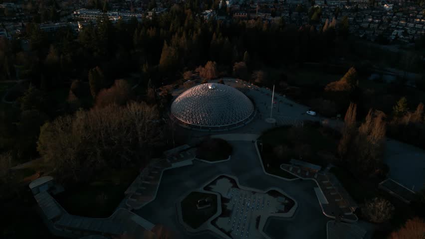 aerial shot revealing bloedel observatory in Queen Elizabeth Park and Vancouver city at sunset, british columbia, canada