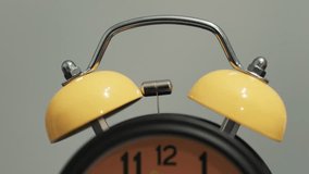 Vintage alarm clock sounding the alarm in the morning. Bell of an alarm clock ringing. - Powered by Shutterstock - Get 15% off with code: PIKWIZARD15