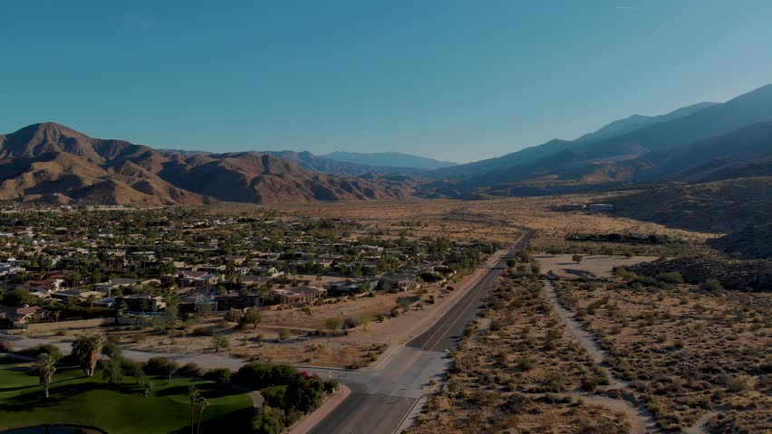 Outskirts of small desert town golf course and palm springs neighborhood