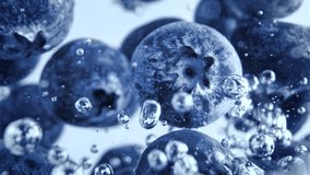 Super Slow Motion Shot of Fresh Blueberries Falling into Water and Creating Bubbles at 1000fps. - Powered by Shutterstock - Get 15% off with code: PIKWIZARD15