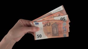 Female hand holding euro banknotes while burning. Green screen, isolated on black background with alpha channel. The concept of inflation and devolution, the depreciation of money, the global crisis. - Powered by Shutterstock - Get 15% off with code: PIKWIZARD15