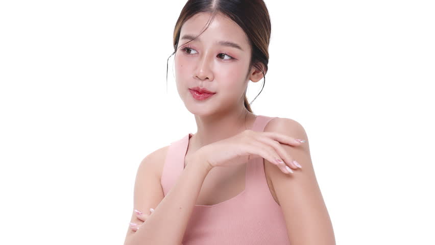 Close up portrait beautiful young Asian woman with healthy facial skin isolated over white background.