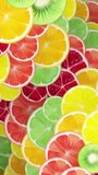 	
Vertical video - vibrant colorful fresh fruit slices motion background in the style of an oil painting. Fruits include orange, lemon, lime, grapefruit, pomegranate and kiwi.