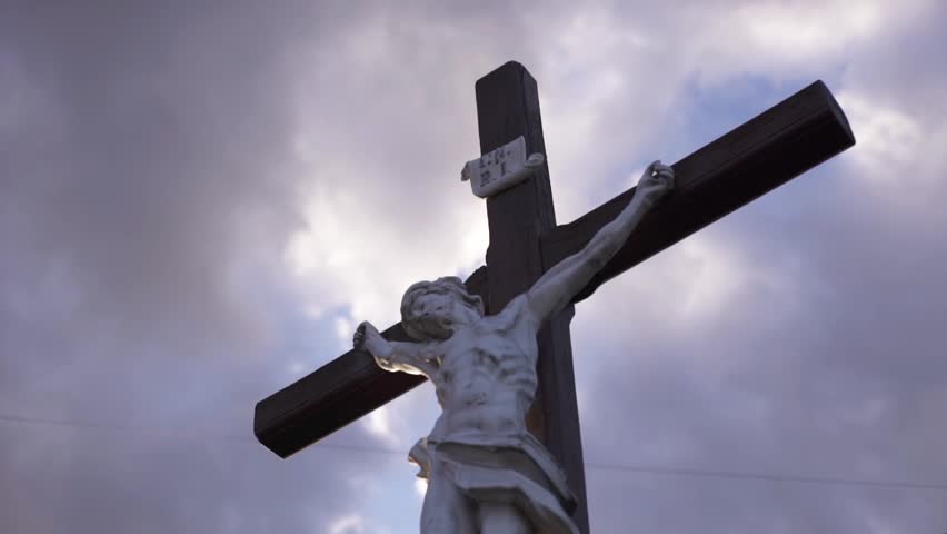 Dramatic Shot. Crucifixion Of Jesus Christ In The Rays Of The Setting Sun