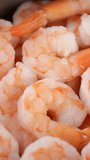 Fresh pink shrimp close up, rotation. Vertical video
