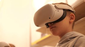 close-up of a boy wearing virtual reality glasses. virtual reality joysticks 
