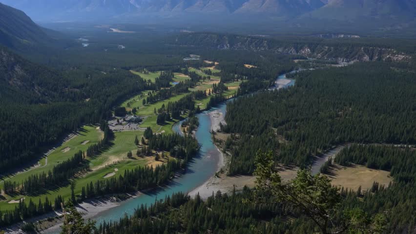 Aerial view of Banff Springs Golf Course and Tunnel Mountain, Banff National Park, Alberta, Canada.
 Royalty-Free Stock Footage #3468292853