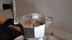 Making Moka Coffee Preparing Espresso Coffee Using a Retro Italian Moka Pot. Coffee Flow,  4K Video Close-up