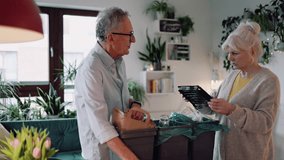 Senior couple sorting garbage in recycling bins at home
 - Powered by Shutterstock - Get 15% off with code: PIKWIZARD15
