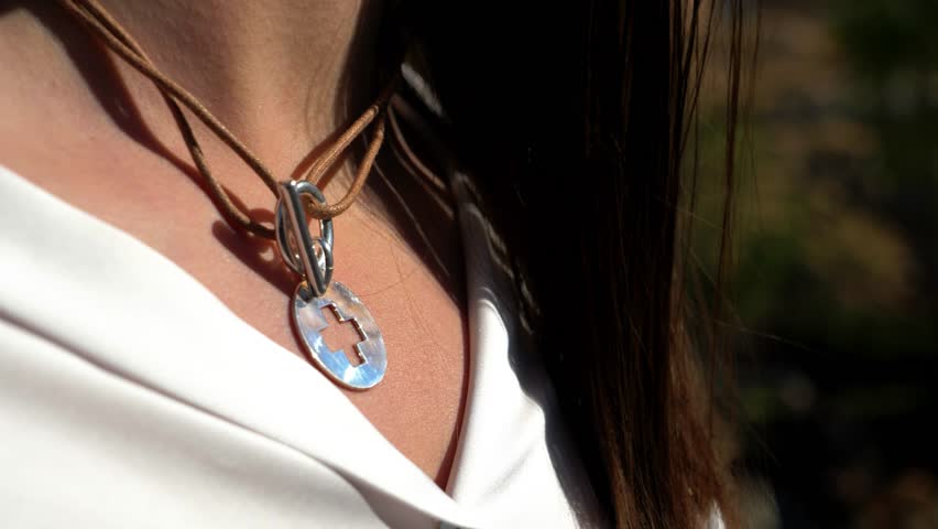 Cross Pendant on Leather Necklace Close-up