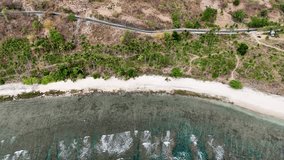 Aerial view of coastline in Lombok Island, West Nusa Tenggara, Indonesia. Beach resort island in east from Bali island. Aerial drone 4K video footage