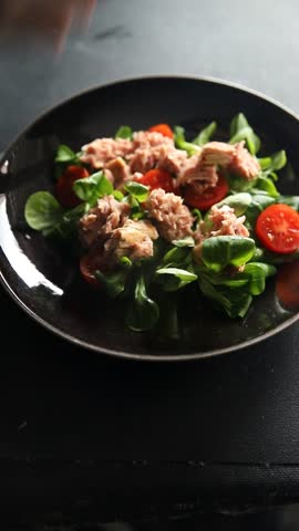 tuna salad, tomato, green leaf lettuce, onion healthy eating cooking appetizer meal food snack on the table copy space food background keto or paleo diet