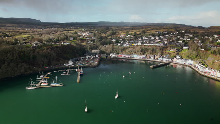 Slow Lateral Arc Aerial View of a Harbor Port of Tobermory With Boats Royalty-Free Stock Footage #3468501653
