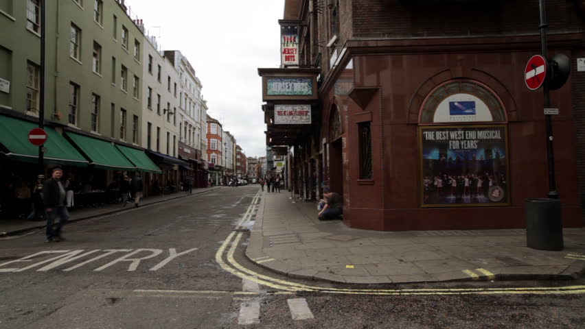 LONDON - OCTOBER 7, 2011: A little street with a people walking down the
