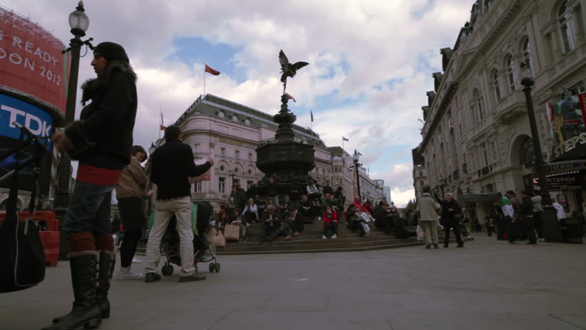 LONDON - OCTOBER 7, 2011: Crowd of people by the Eros statue in London