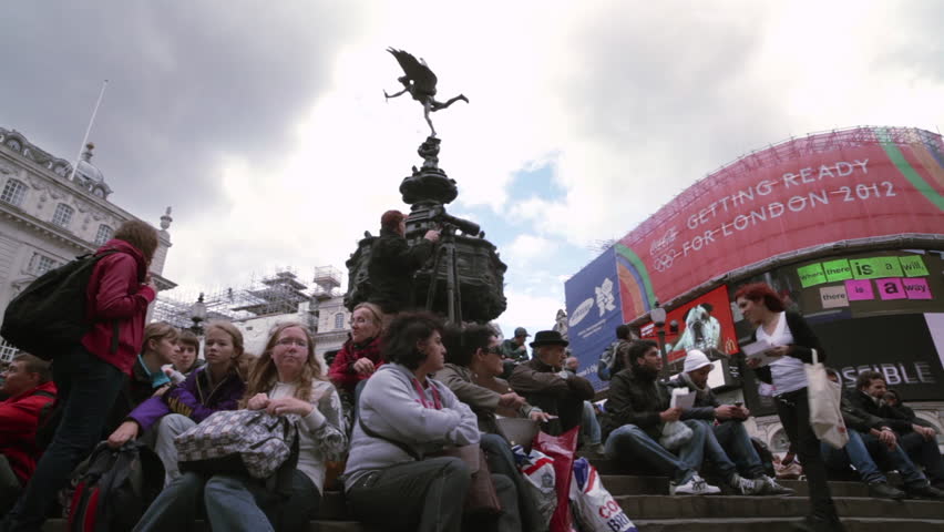 LONDON - OCTOBER 7, 2011: Crowd on the steps of the Eros statue in the afternoon