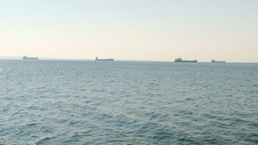 Transport ships on a horizon at sea