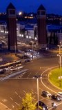 Aerial timelapse of Placa d'Espanya, Plaza de Espana, the Spanish Square in Barcelona, Catalonia, Spain with city traffic in the evening. With camera zoom out