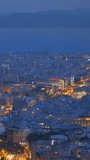 Famous greek tourist landmark - the iconic Athens view and Parthenon Temple at the Acropolis of Athens as seen from Mount Lycabettus, Athens, Greece. Horizontal camera pan