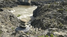 Video of stone pyramid on the bank of Altai river Katun and rapids Oroktoy Teldekpen near Oroktoysky bridge.