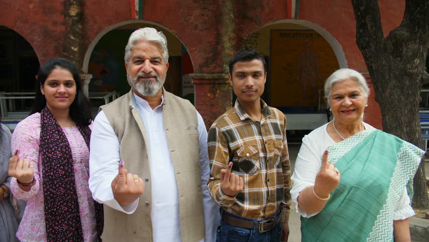 A group of happy voters showing their inked-marked index fingers in front of the camera - registered voters, a democratic, Indian citizenship. Candidates of every age cast a vote and pose for the c... Royalty-Free Stock Footage #3468659909