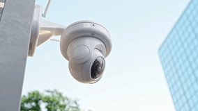 CCTV camera in cities with tall buildings. Selective focal of the lens. Can be used background in security work. Animation and Selective focus on lens. - Powered by Shutterstock - Get 15% off with code: PIKWIZARD15