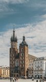 Krakow, Poland. St. Mary's Basilica And Cloth Hall Building. Landmark Church Of Our Lady Assumed Into Heaven. Saint Mary's Church In Of Main Market Square. vertical, vertical footage, vertical video.