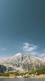 Tatra National Park, Poland. Calm Lake Czarny Staw under Rysy And Summer Mountains Landscape. hyperlapse View Of Five Lakes Valley. vertical, vertical footage, vertical video.