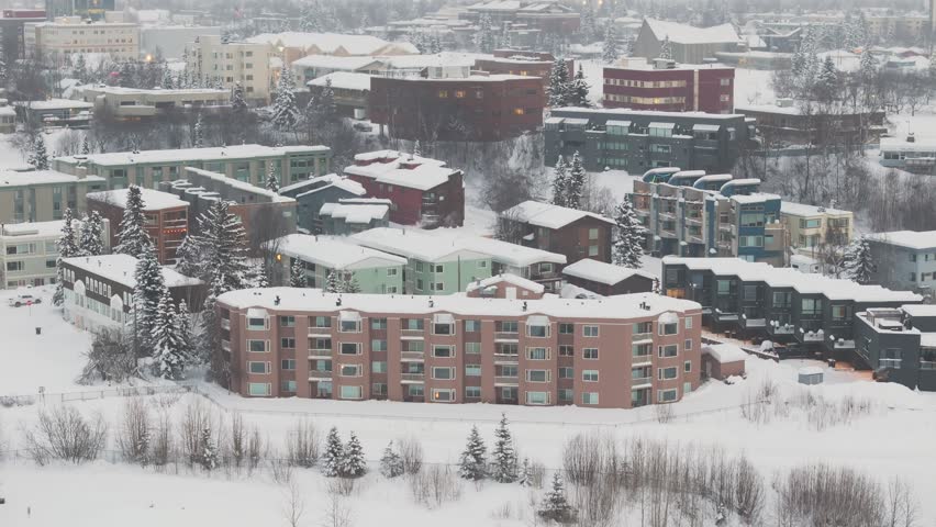 Drone shot of housing in Anchorage Alaska with snowy weather