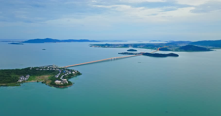 Aerial video of beautiful lake and island natural landscape at dusk in Taihu, Suzhou. drone forward shot.