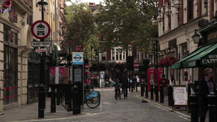 LONDON - OCTOBER 9, 2011: Streets with unidentified people walking on the