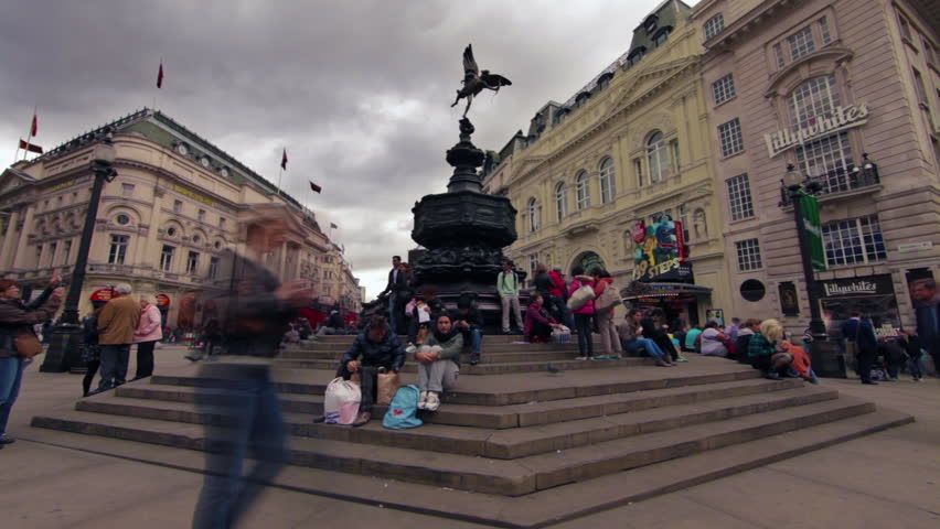 LONDON - OCTOBER 9, 2011: Time lapse as people walk by the Eros statue