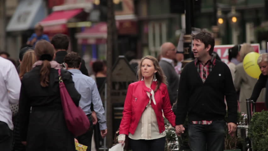 LONDON - OCTOBER 9, 2011: Unidentified people walk in England 