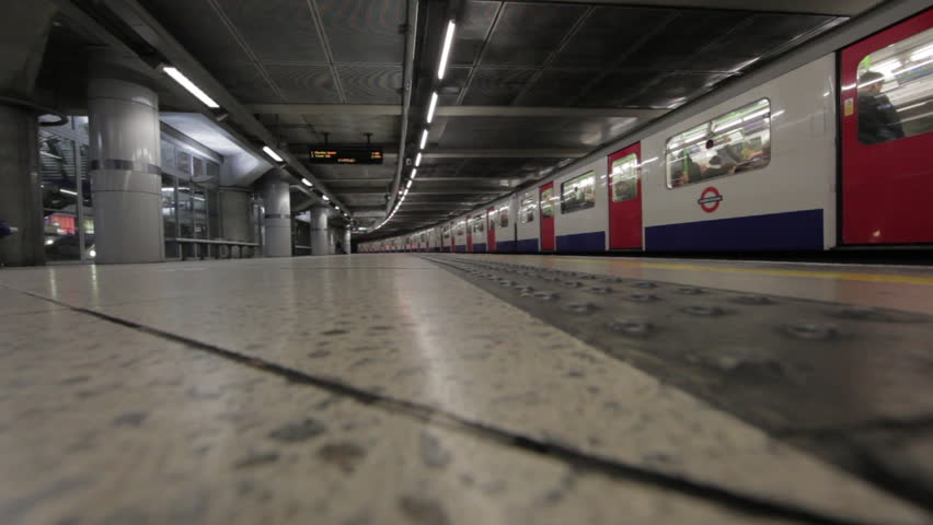 LONDON - OCTOBER 9, 2011: Train drives away in underground train station in