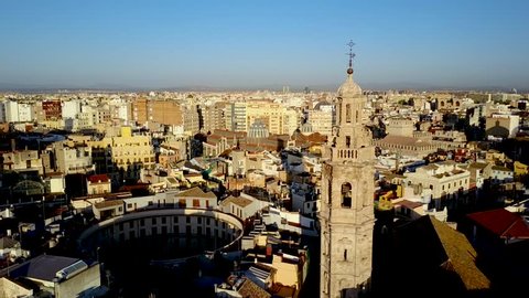 Valencia Spain aerial footage panning across Santa Catalina Church and Tower.