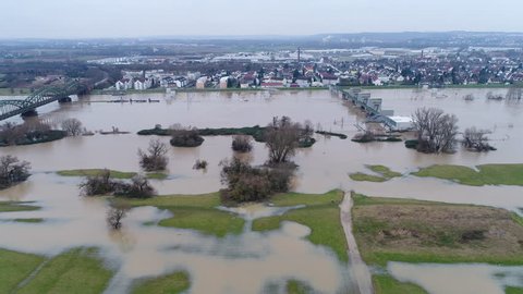 Flooded river banks and water lock at Main River, Germany after heavy rainfall - aerial view