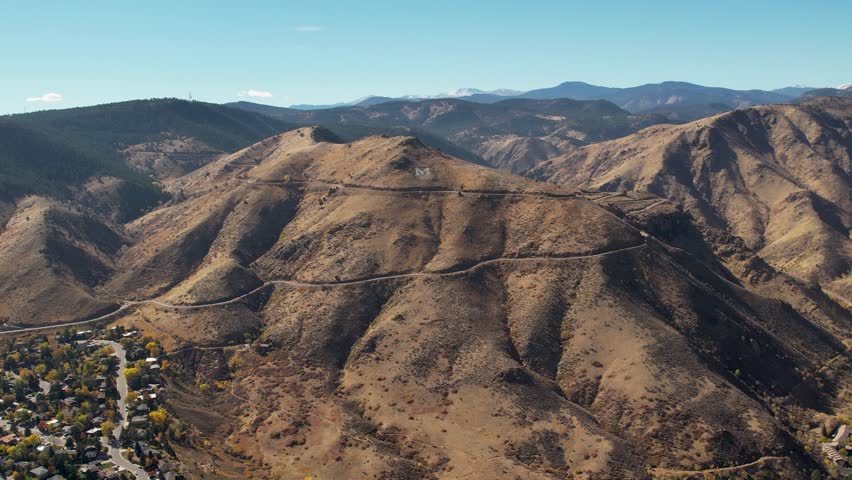 A 4K drone shot of the giant “M” built on top of Mount Zion, which stands for “Mines” for the Colorado School of Mines college, in Golden, Colorado, USA.