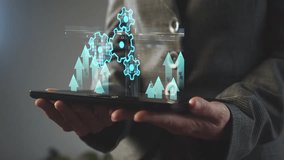 Gears against the background of growing indicators in graphs and diagrams in the form of a hologram over a digital tablet in the hands of a businesswoman. Concept for implementing a new project. Cg - Powered by Shutterstock - Get 15% off with code: PIKWIZARD15