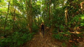 Caucasian woman is running in tropical rainforest in Thailand - Powered by Shutterstock - Get 15% off with code: PIKWIZARD15
